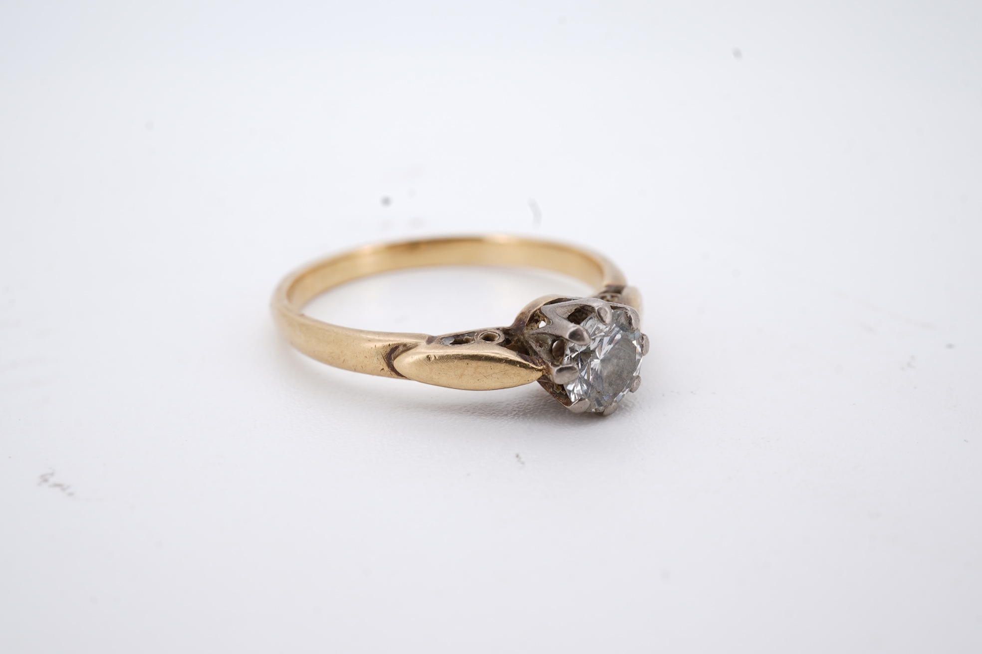 An 18ct and solitaire diamond set ring, the stone weighing approximately 0.30ct, size N, gross weight 2.8 grams.